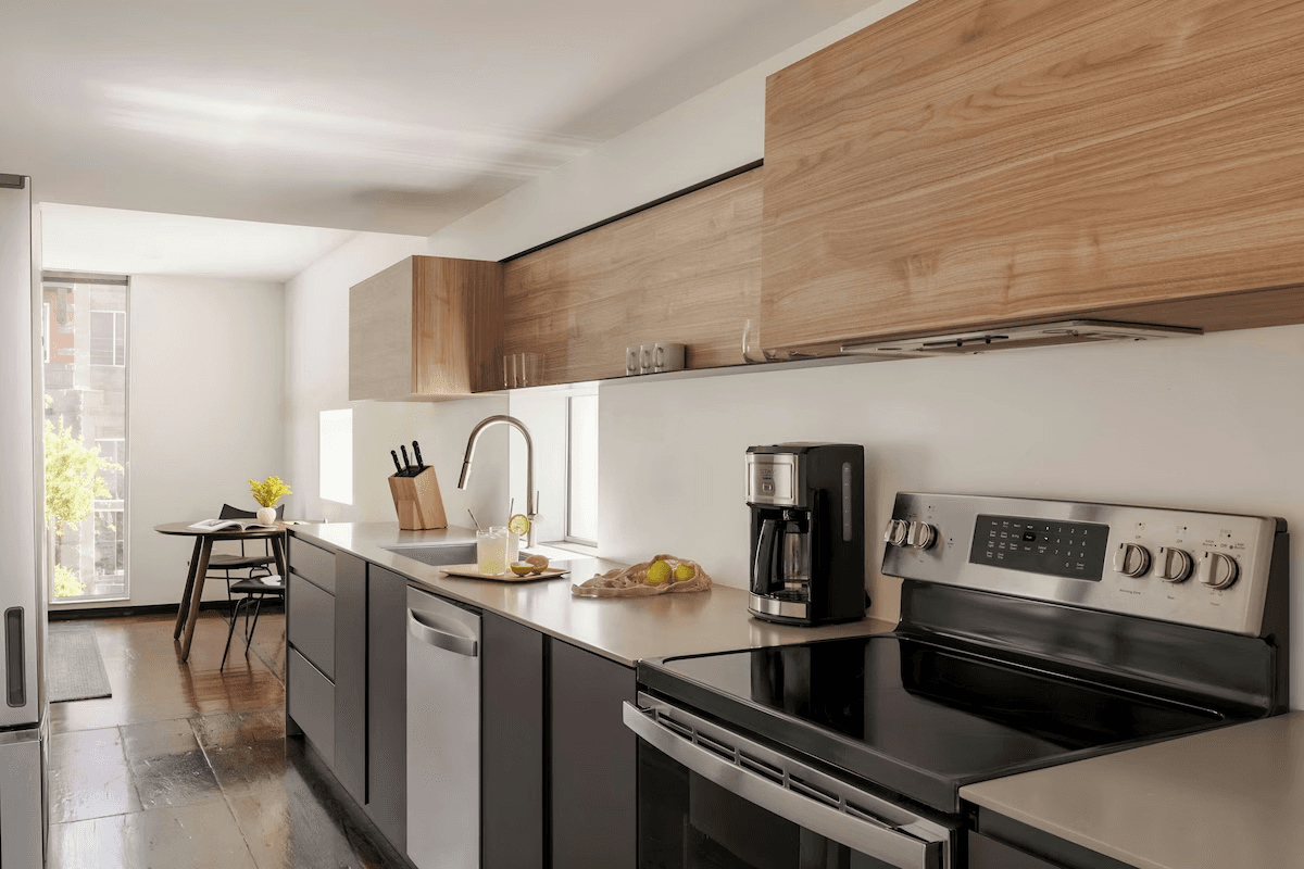 A one-bedroom stay bathroom with clean architectural finishes.